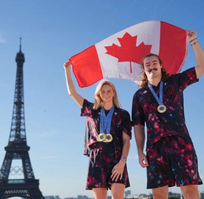 :] Canadian athletes Summer McIntosh and Ethan Katzberg proudly display their Olympic gold medals. (Photo via Facebook.)