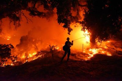 Firefighters battle devastating fires in southern California. (Photo via California Wildfire’s Facebook page.)