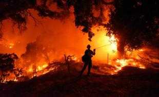 Firefighters battle devastating fires in southern California. (Photo via California Wildfire’s Facebook page.)